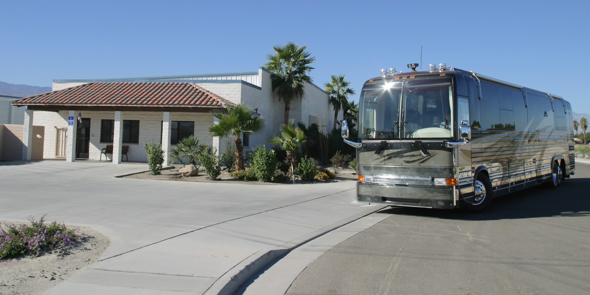 A motorcoach outside the All Inside RV Storage office
